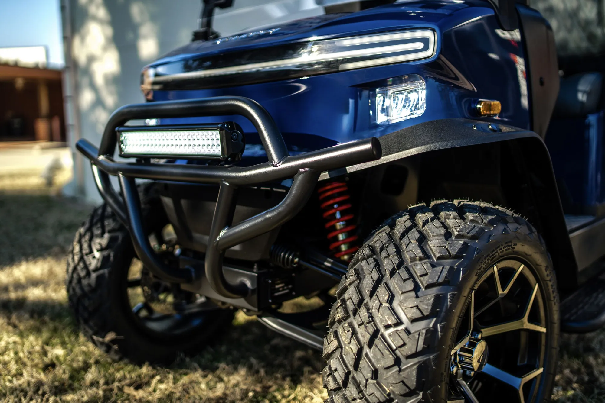 Blue Denago Rover XL6 with LED light bar and lifted off-road tires