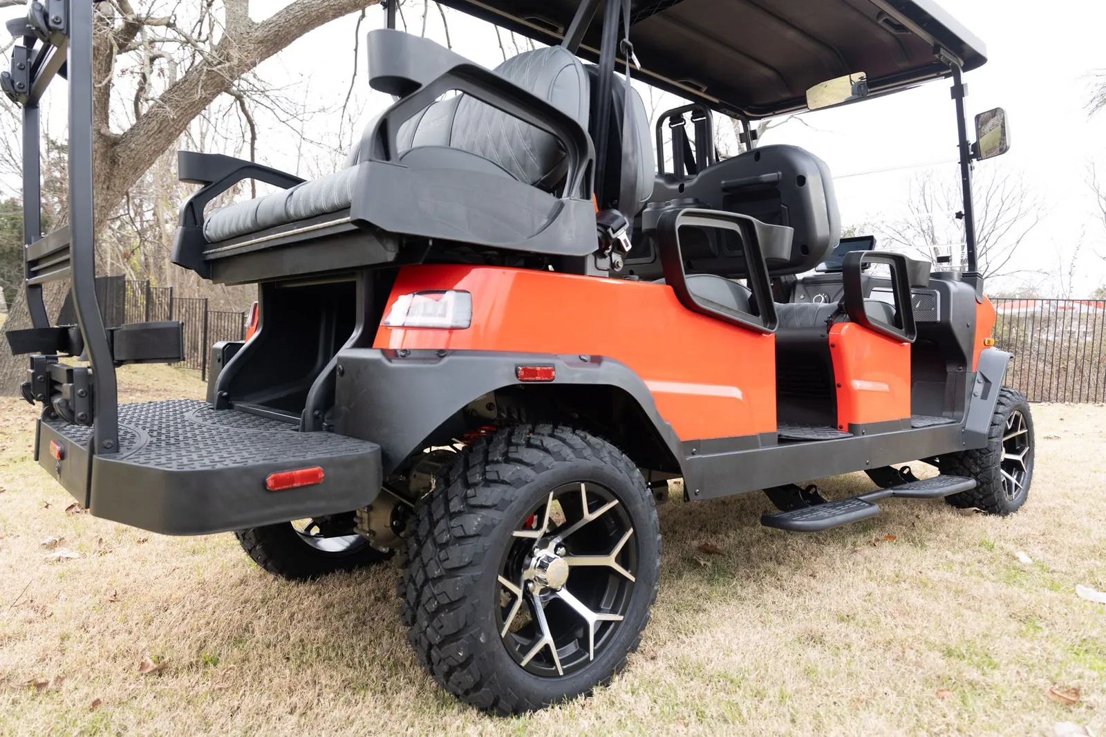 Orange Denago Rover XL6 with rear-facing seat
