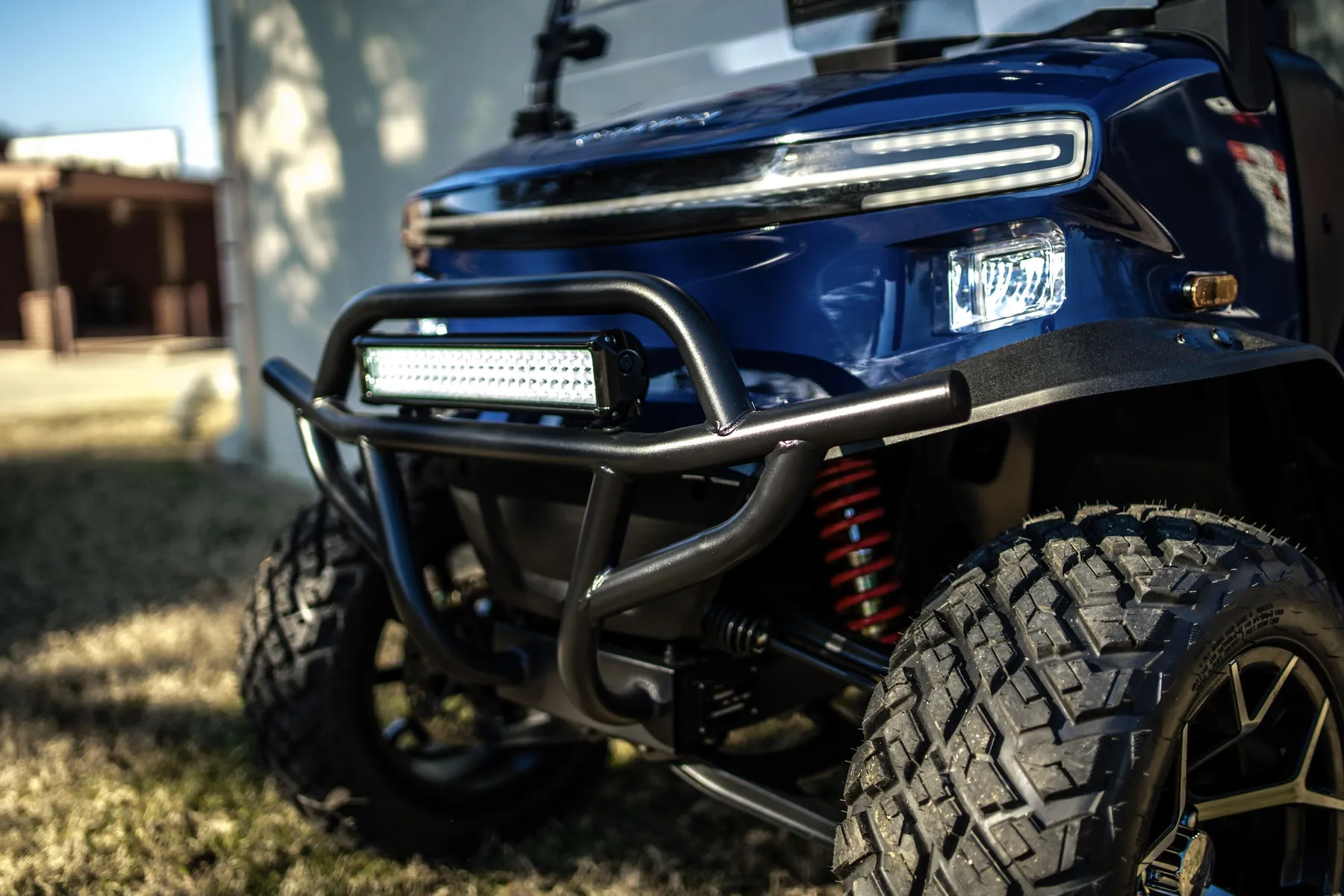 Blue Denago Rover XL6 with LED light bar and brush guard